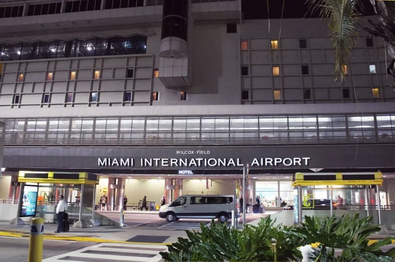 Image of Miami International Airport from the front, taken at night.