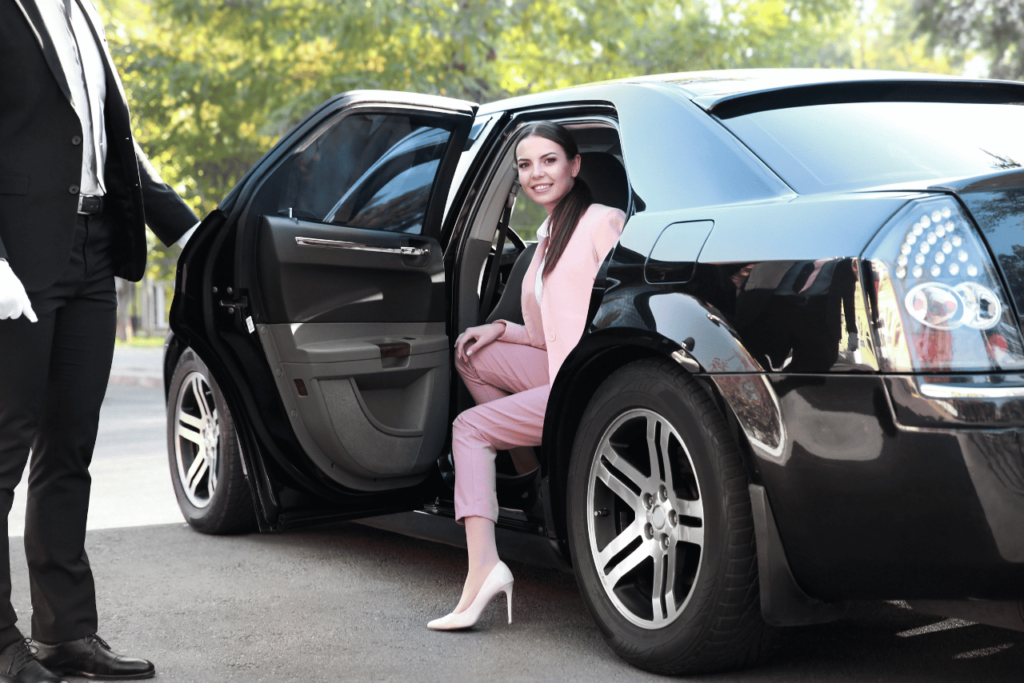 A lady getting out of the Best Luxury Car Service in Los Angeles